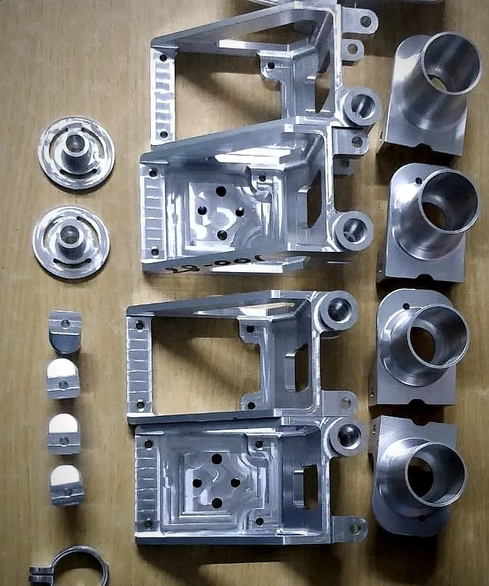 Machined aluminium brackets, flanged cups and small components