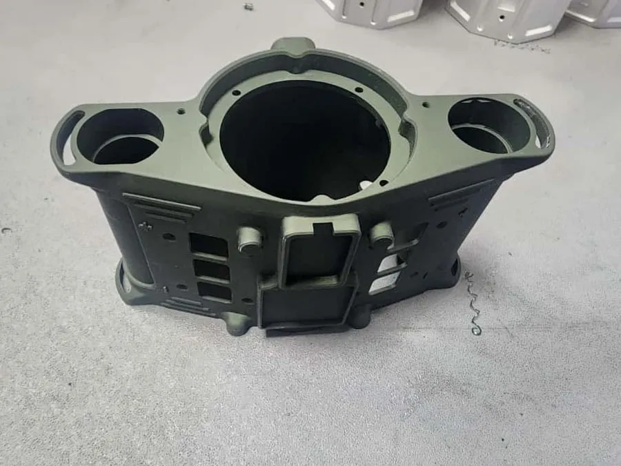 Machined housing with an olive-green protective coating
