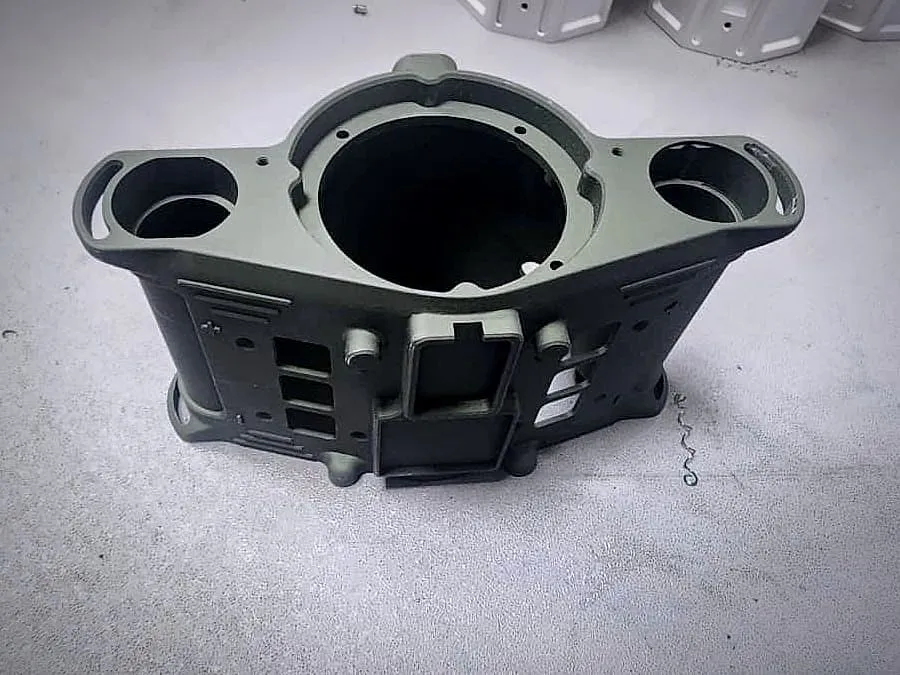 Machined housing with an olive-green protective coating