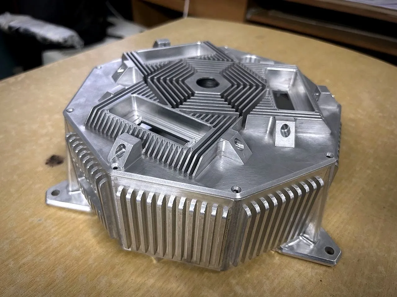 Octagonal aluminium housing with machined cooling fins and mounting lugs