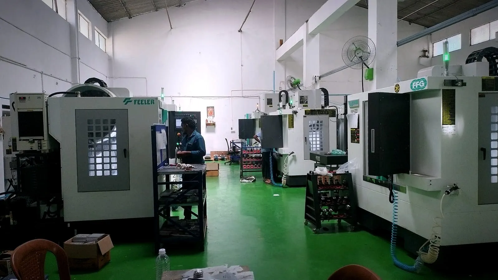 Shop floor in Peenya with vertical machining centres and tool trolleys